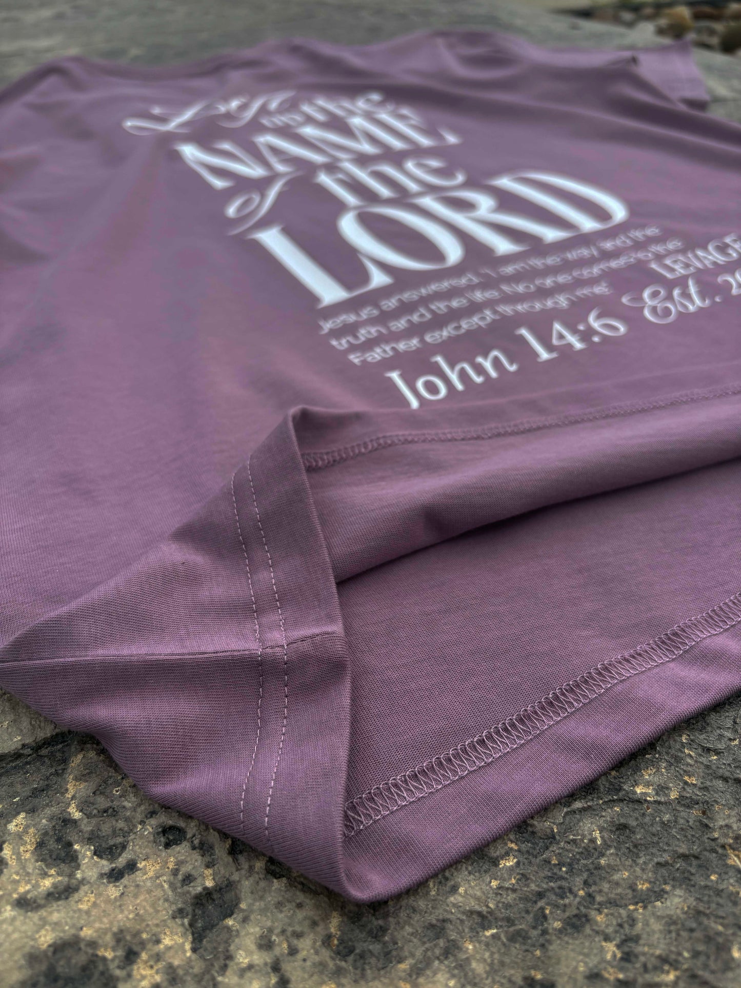 Rise Faith T Shirt showing front and back views, logo on collar, and inspirational quote design for fashion branding.