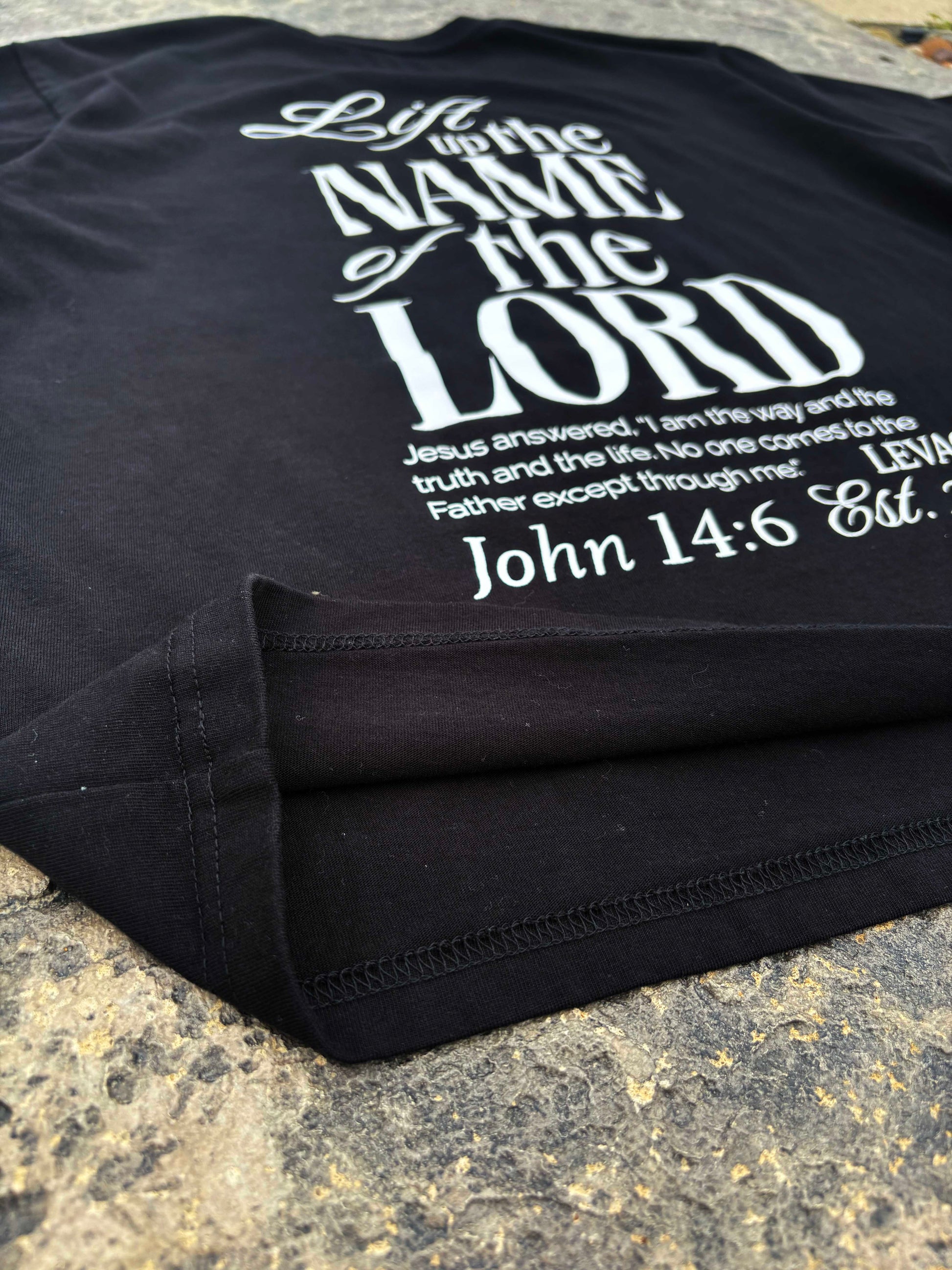 Rise Faith T Shirt showing front and back views, logo on collar, and inspirational quote design for fashion branding.