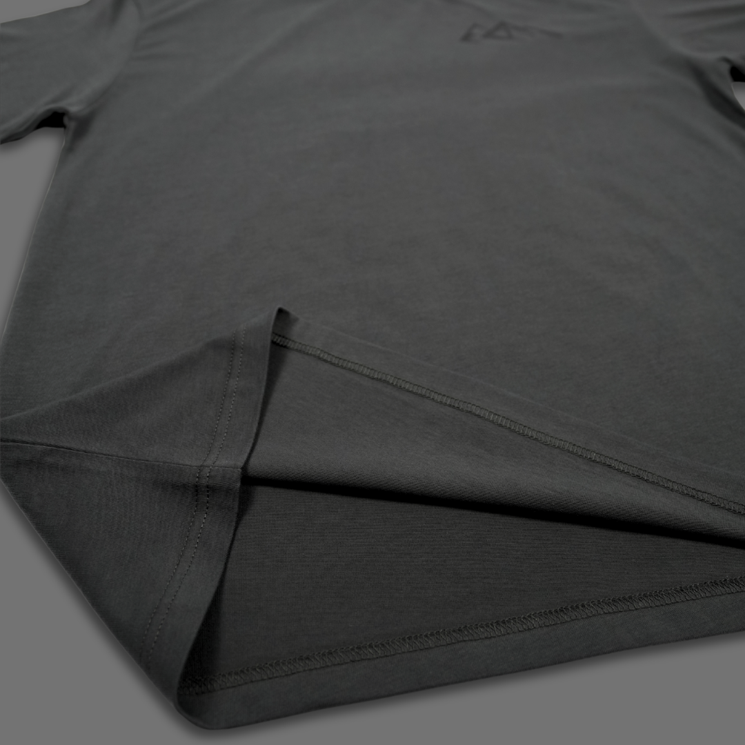 A white short-sleeve crewneck t-shirt by LEVAGE, featuring a black geometric mountain logo on the center chest and a white hangtag with the brand name.