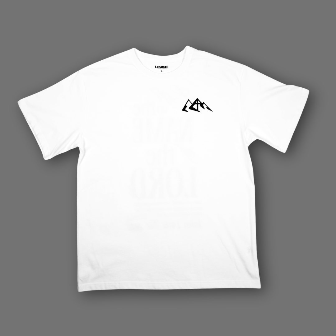 A white short-sleeve crewneck t-shirt with a small black mountain logo on the left chest, displayed flat against a solid gray background.